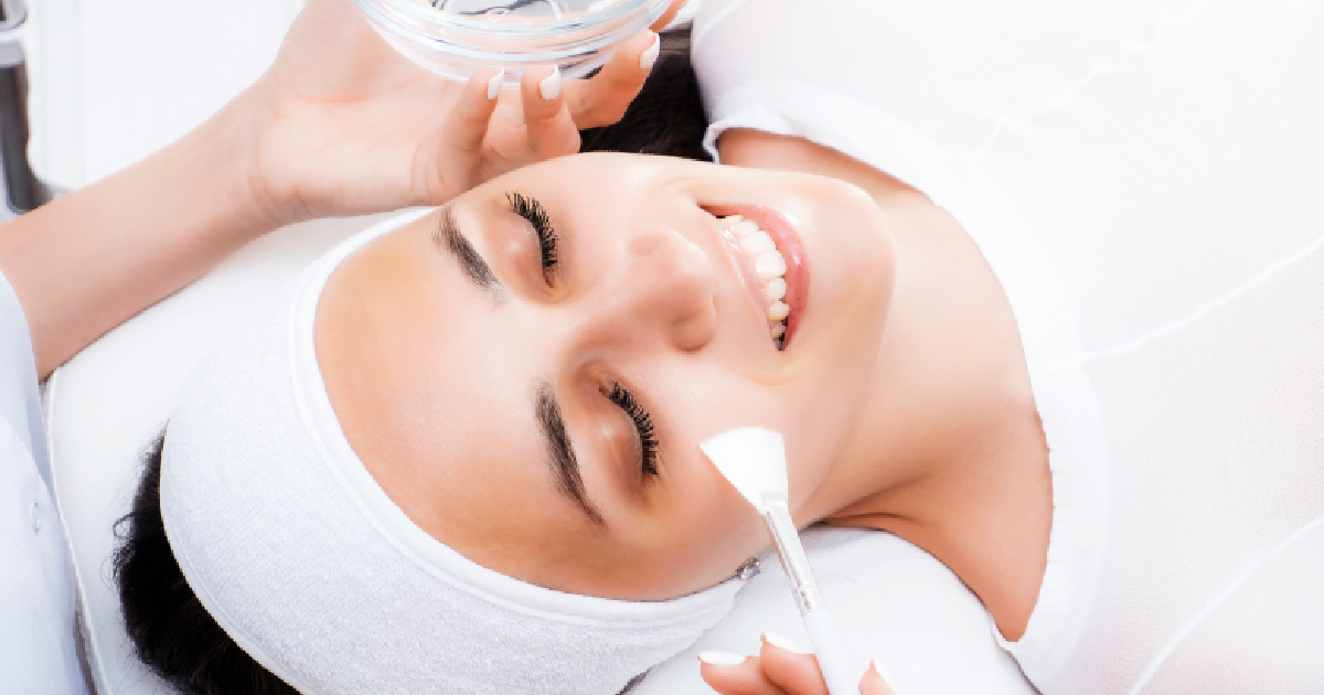 Woman receiving a chemical peel treatment in El Cajon, CA, showcasing professional skincare for textured skin.